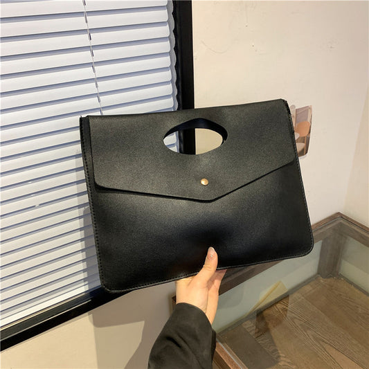Black leather clutch bag 